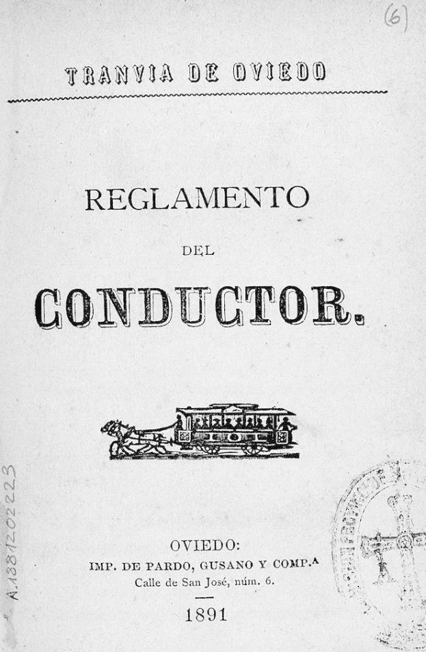 Ein altes Buch mit einer Zugillustration auf dem Titelblatt, darunter der Text 'Reglamento de Conductor' und ein Stempel auf der rechten Seite.