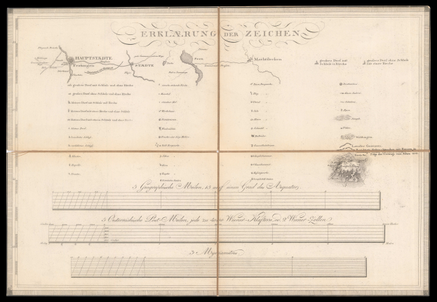 Ein aufgeschlagenes Buch mit schwarzem Einband, das eine Deutschlandkarte zeigt, mit Text und einer Zeichnung auf seinen Seiten.