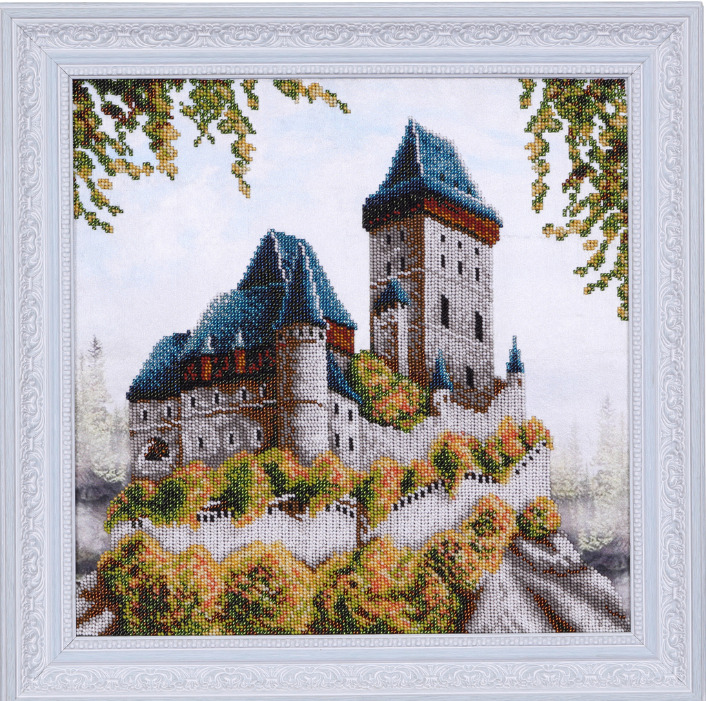 Ein hölzerner Bilderrahmen mit einem Haus darin.