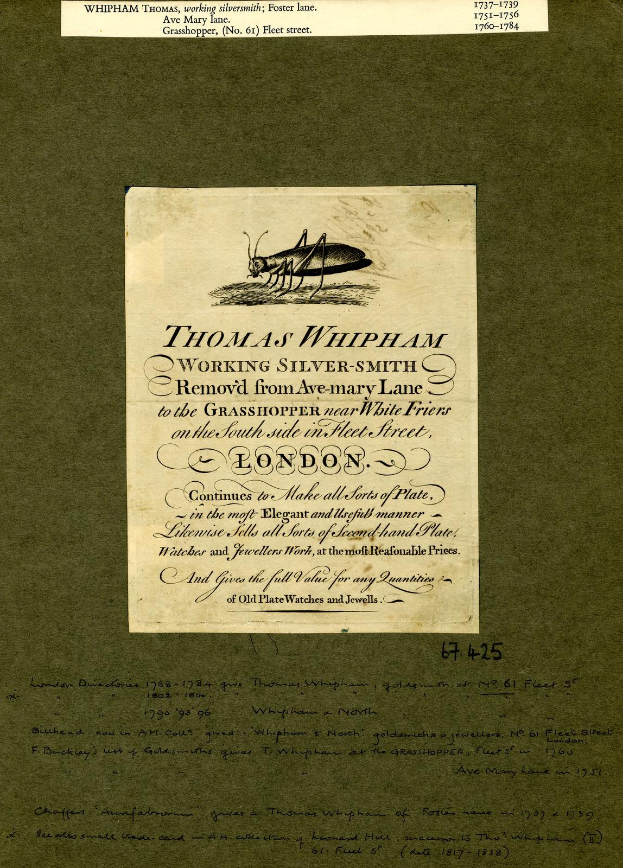 Ein altes Buch mit einer Zeichnung einer Heuschrecke auf dem Cover, das handgeschriebene Text auf der Seite enthält.